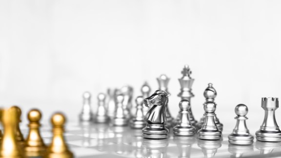 Chess board game on white background, business competitive concept, copy space