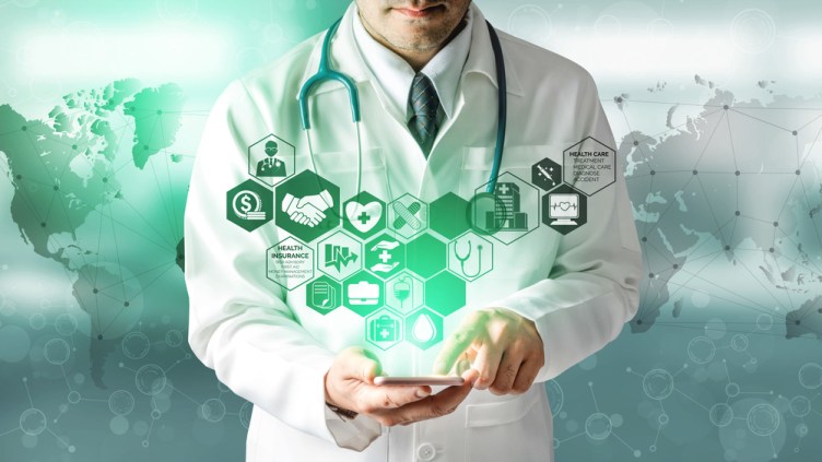 Health Insurance Concept - Doctor in hospital with health insurance related icon graphic interface showing healthcare people, money planning, risk management, medical treatment and coverage benefit.