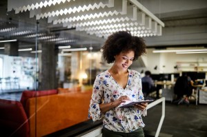 Close up of a female employee using a tablet