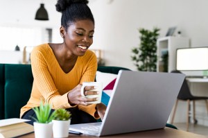 Smiling woman working at home