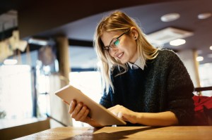 Student studying remotely on tablet pc