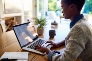 Woman working from home on MacBook