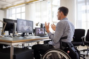 Businessman with disability having a video call at his desk