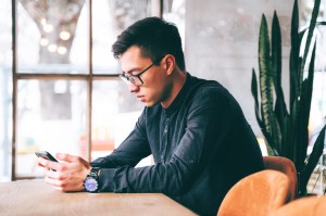 Man looking at mobile device