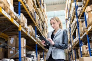 Frontline worker using mobile device in warehouse
