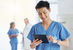 Hospital doctor using a tablet