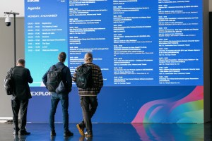 Attendees view the agenda digital sign at VMware Explore 2024 Barcelona