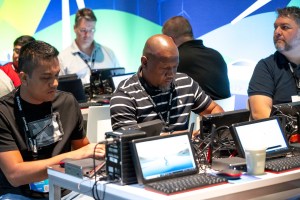 Attendees at workstations at VMware Explore