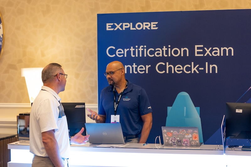 Attendee checking in at the certification exam center at VMware Explore