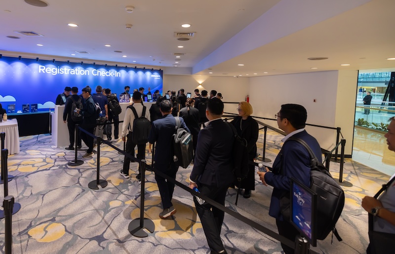 Attendees at VMware Explore on Tour in Singapore registration line