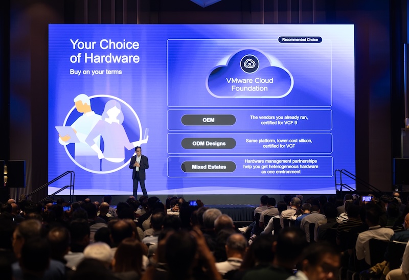 VMware Explore on Tour in Singapore Attendee Audience in front of large VCF display