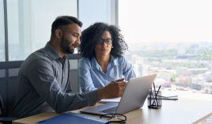 colleague developers problem solving around computer