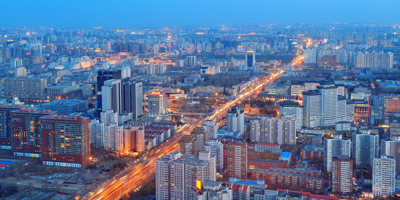 Beijing at night aerial view with urban buildings.