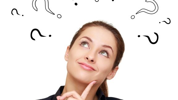 Thinking smiling woman with questions mark above head looking up isolated on white background
