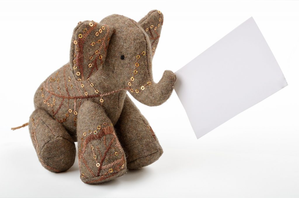 Elephant toy with reminder card