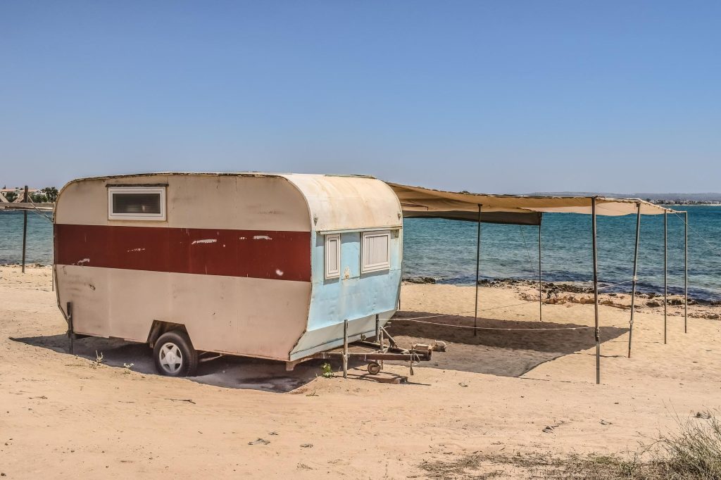 Old trailer on beach