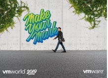 VMworld 2019 US walking with laptop past "Make Your Mark' graffitti