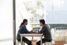 Two DevOps personnel working on PC